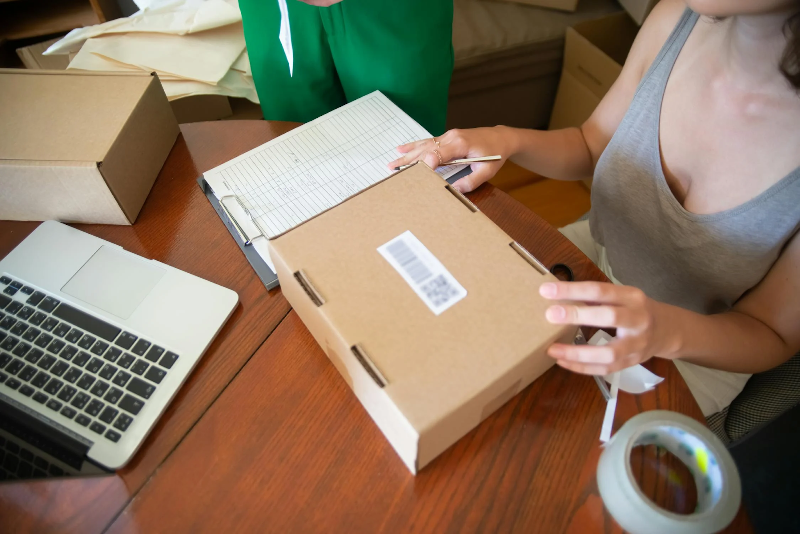 A woman at a desk runs her online store from home