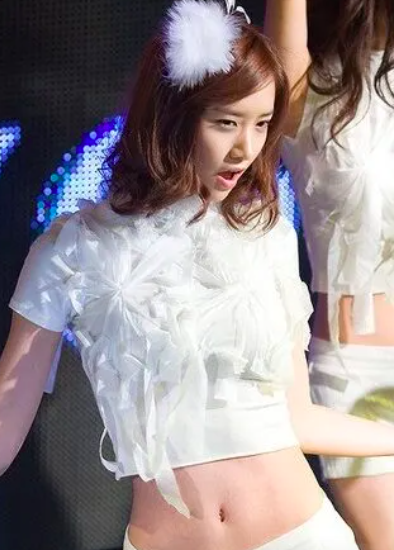 This contains an image of Girls' Generation's YoonA belly button transormation.