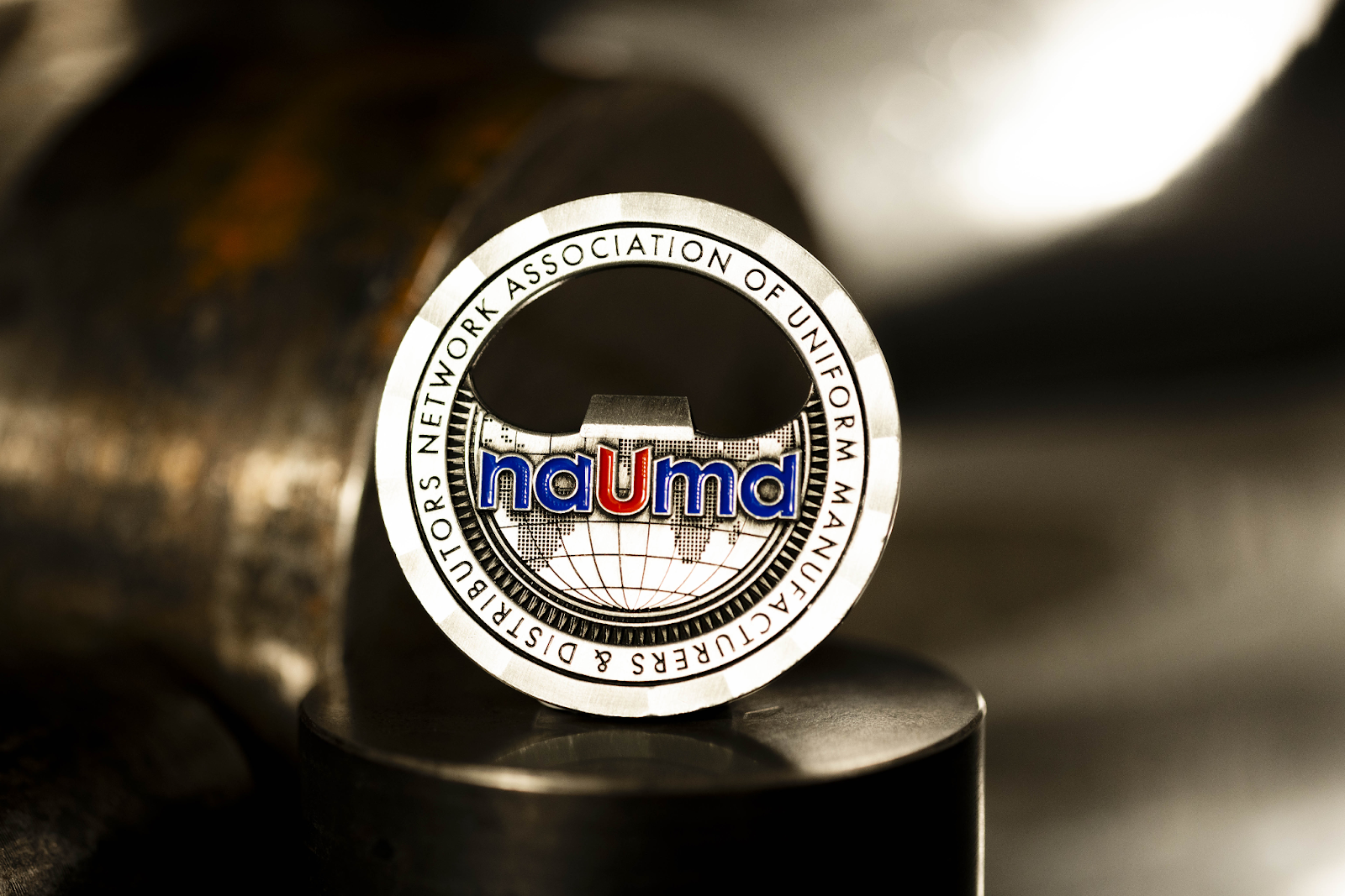 A NAUMD challenge coin with bottle opener.