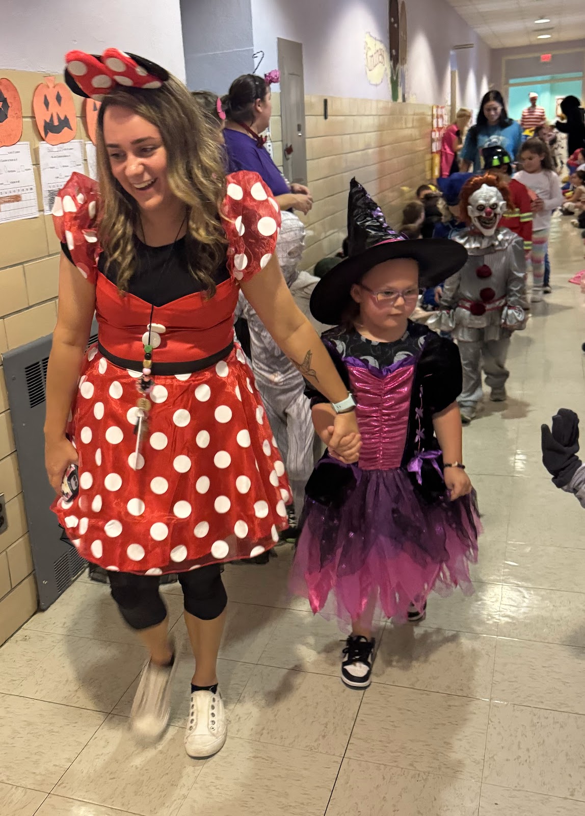 image of students and teacher in costume for Halloween