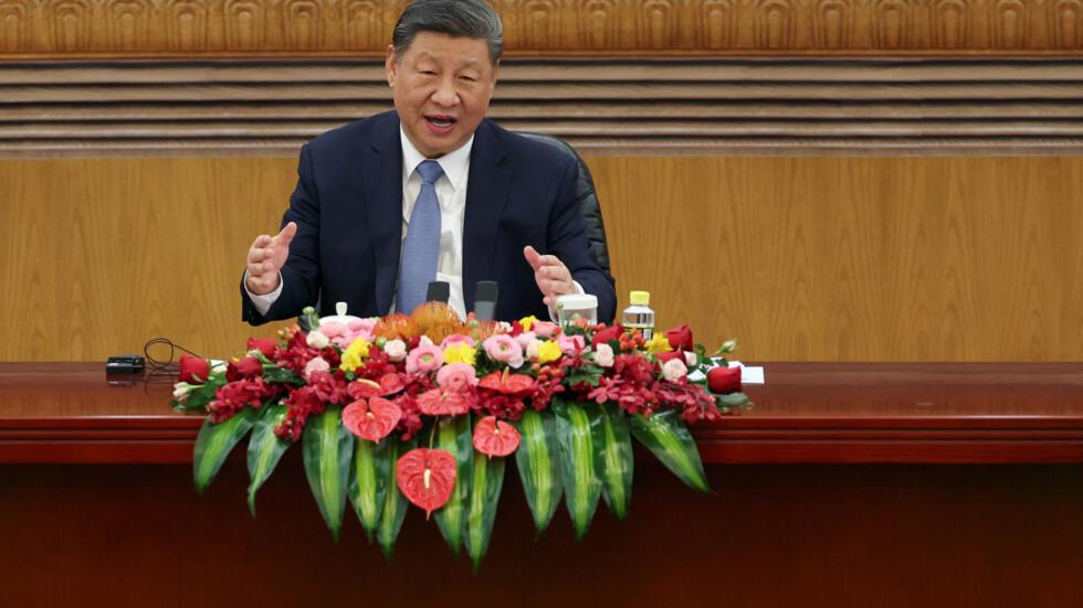 Chinese President Xi Jinping speaks at a meeting with foreign business leaders at the Great Hall of the People in Beijing, China March 28, 2025.