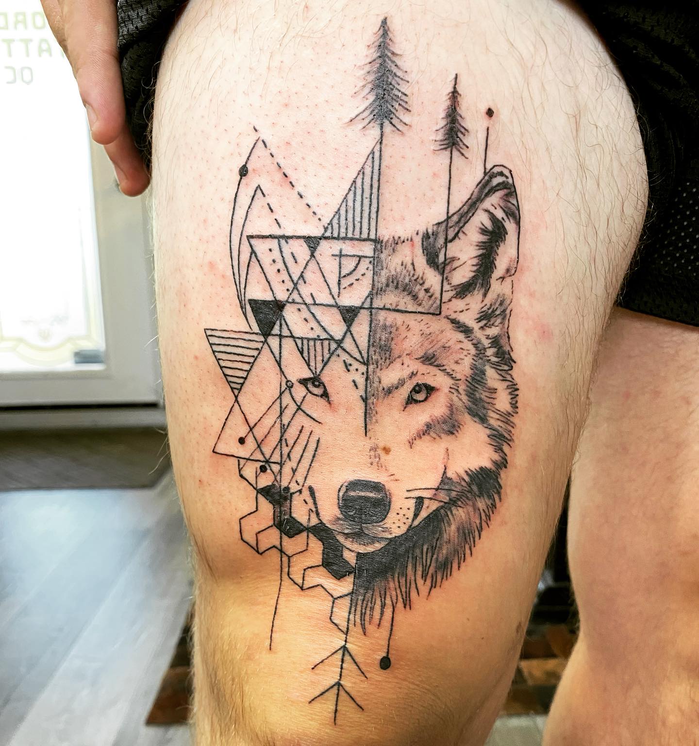 Geometric Wolf Head Thigh Tattoo