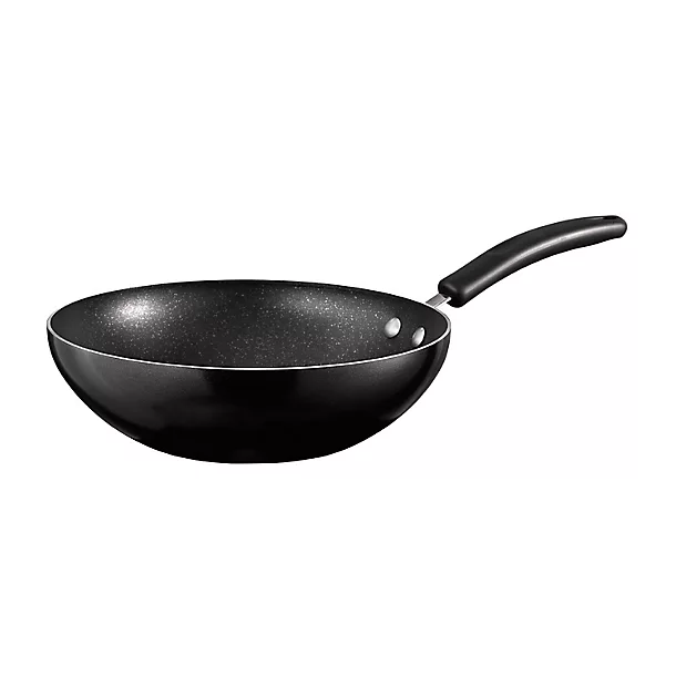 A black non-stick wok with a curved design and a handle on a white background.