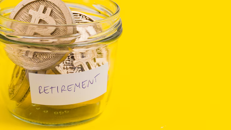 Coins with bitcoin logo in a transparent jar labelled retirement