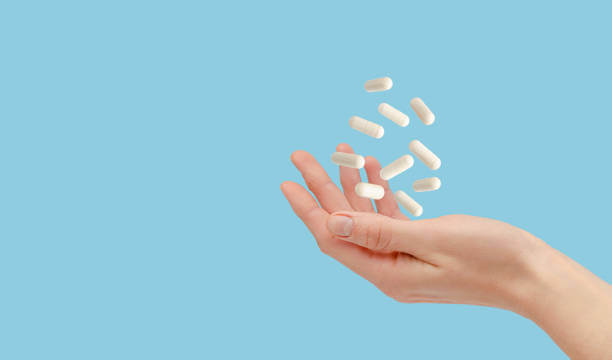 White polyphenol capsules displayed on a vibrant blue background for contrast.