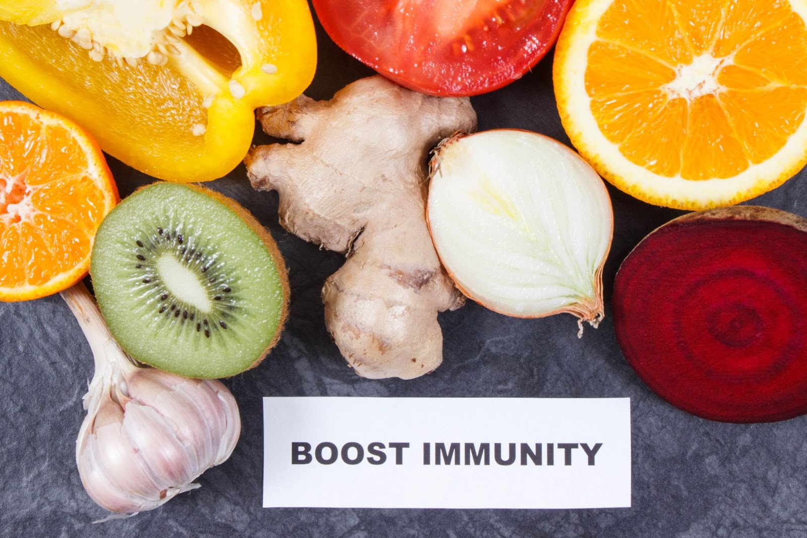 Words “boost immunity” next to fruits, garlic, and ginger. 