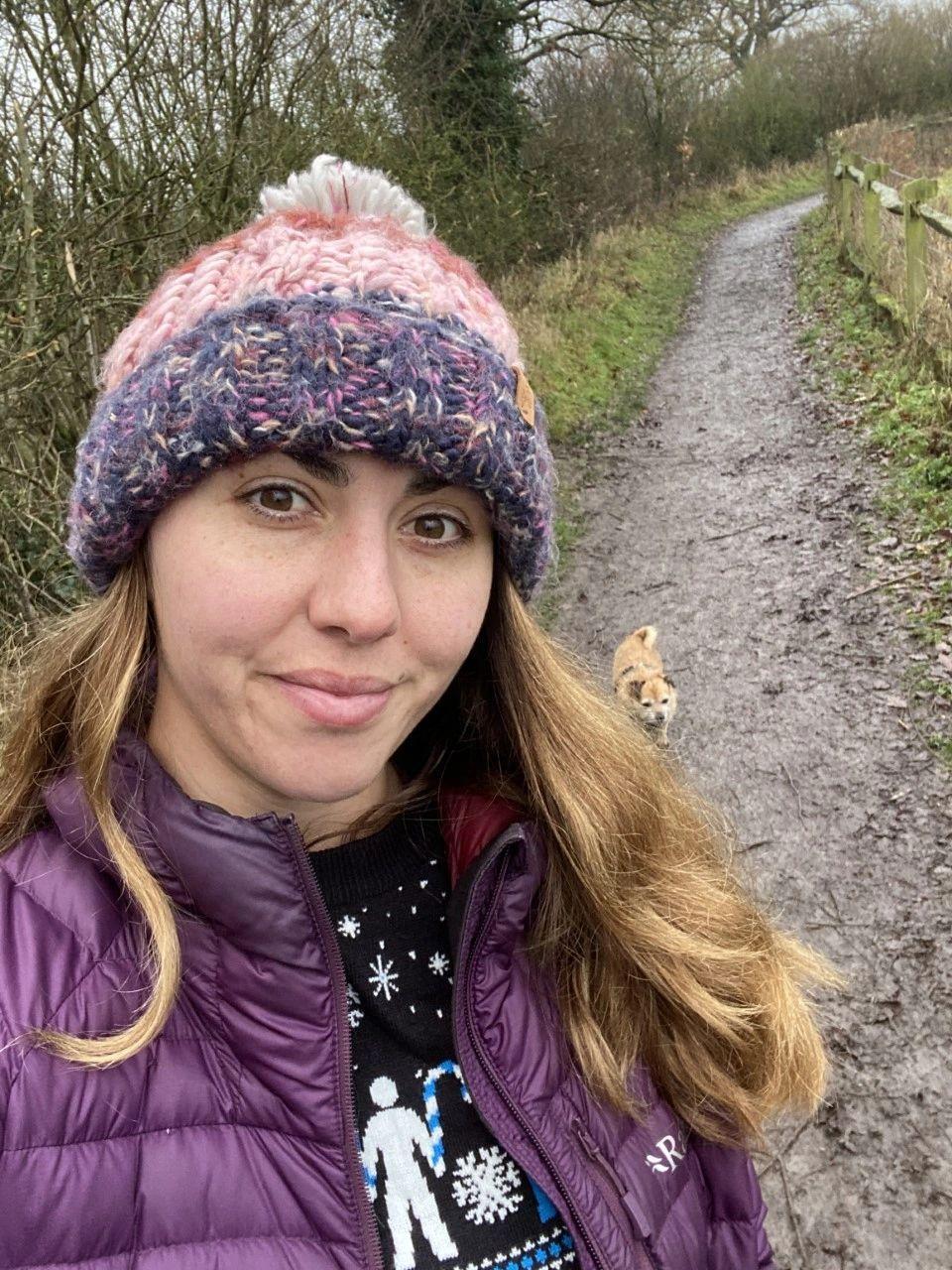 Image shows Nose to Trail owner Rachel walking with her dog Maisy a jack russell cross pug.