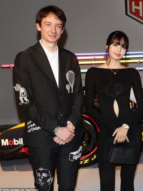 This contains an image of: BLACKPINK's Lisa and Frédéric Arnault's on black outfit 