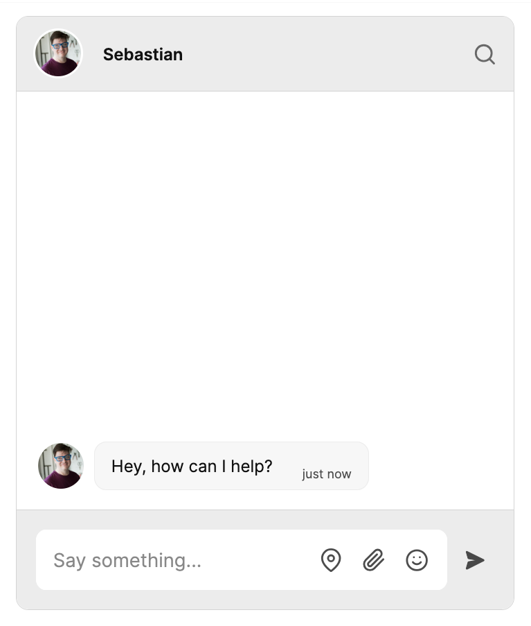 A TalkJS chatbox with a single message by a user named 'Sebastian', saying: 'Hey, how can I help?'