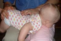 http://www.the-essential-infant-resource-for-moms.com/image-files/burping-baby-lap.jpg