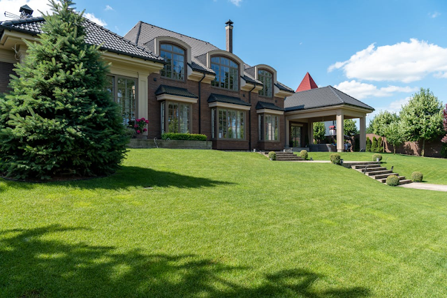 mansion with vast green grass garden