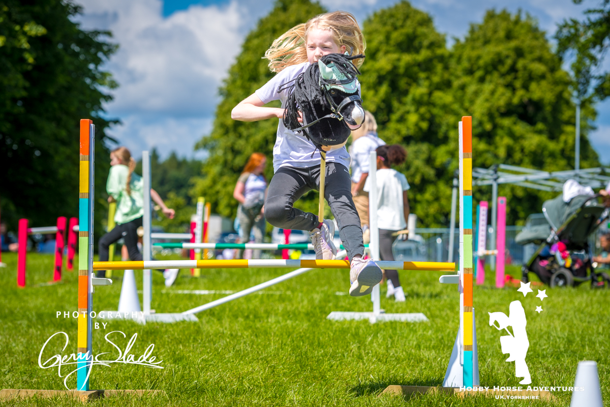 Girl jumping on hobby horse