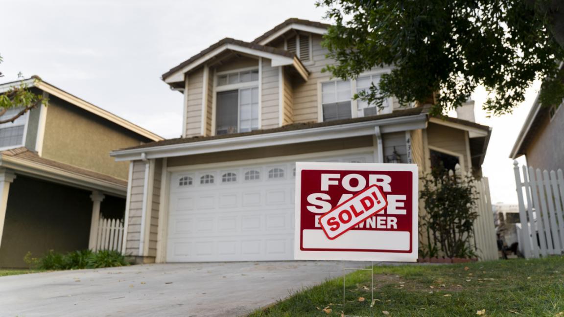 house-with-sold-yard-sign