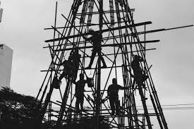 Persons climbing steel structure