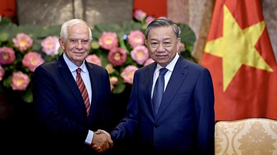 Vietnam's President To Lam (R) shakes hands with High Representative of the European Union for Foreign Affairs and Security Policy Josep Borrell during their meeting at the Presidential Palace in Hano