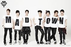 This  contain an image of MADTOWN member holding up letters that spell out the word mad town in front of them