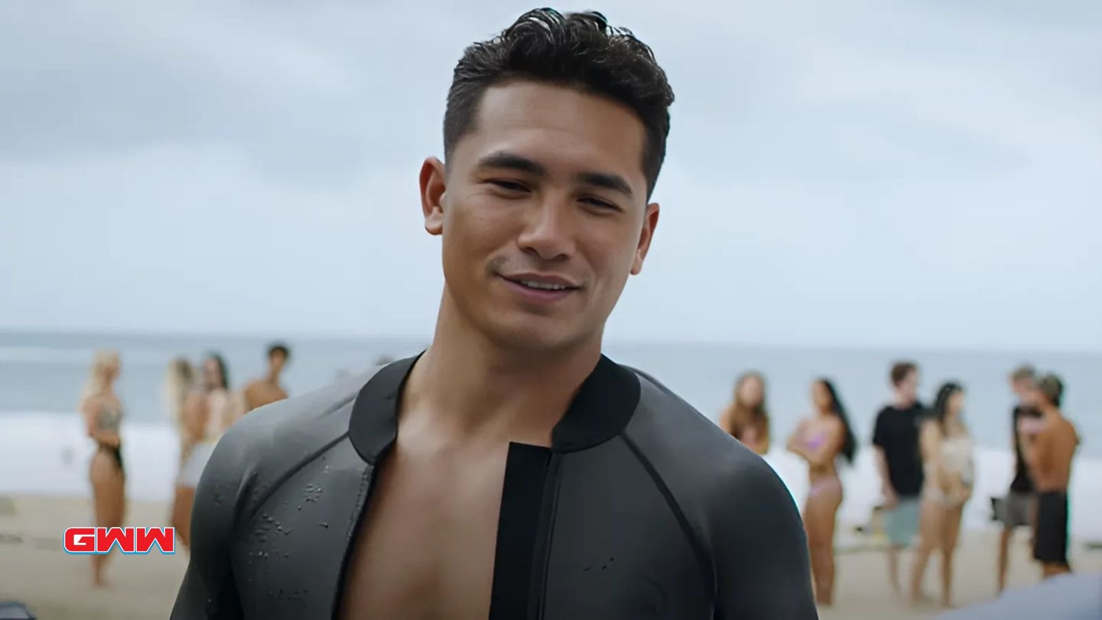 Kekoa Kekumano as Laka Hanohano smiling on the beach in Rescue Hi Surf