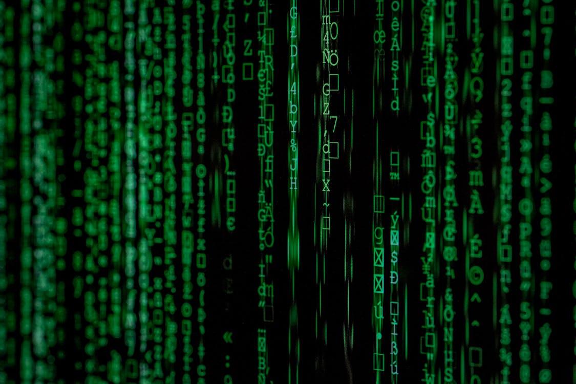 Free Abstract green matrix code background with binary style. Stock Photo