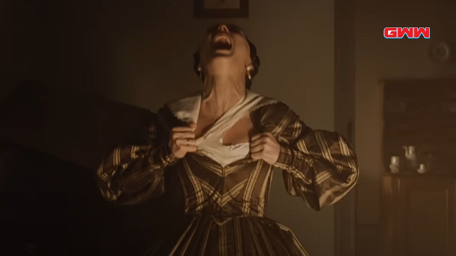 Anna Harding tearing her dress in anguish from Nosferatu 2024 film scene.