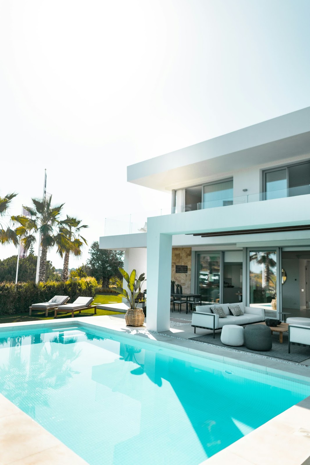A nice house with a inground swimming pool in the backyard.