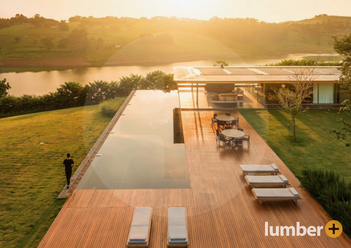 Lumber Plus’s Brazilian Hardwood Decking with lounge chairs surrounding a pool 