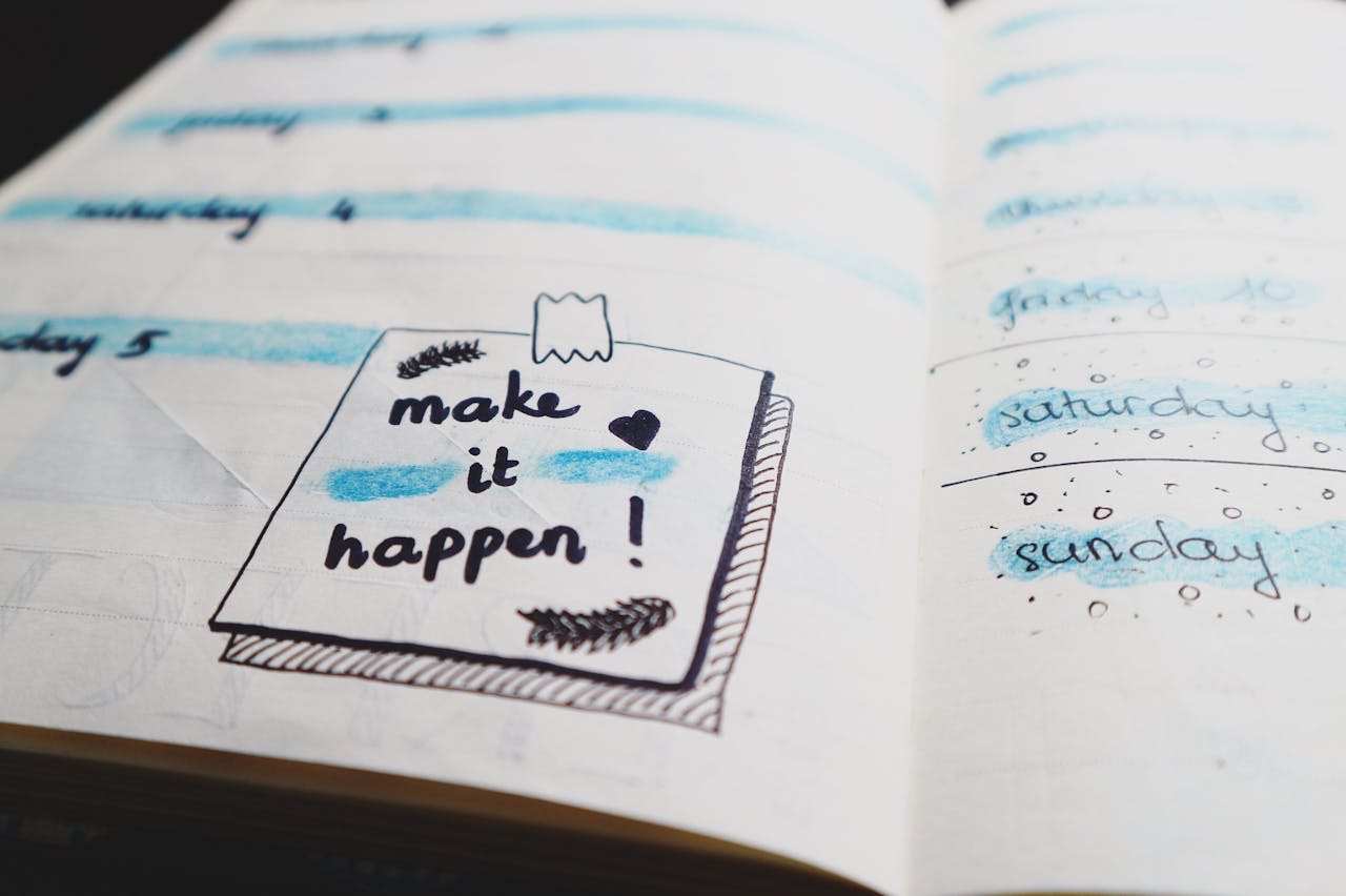 Closeup of notebook that has goals written down in blue and black, also a note that says “make it happen” // Healthier Veterans Today