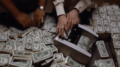 A person's hands over a safe with money

AI-generated content may be incorrect.