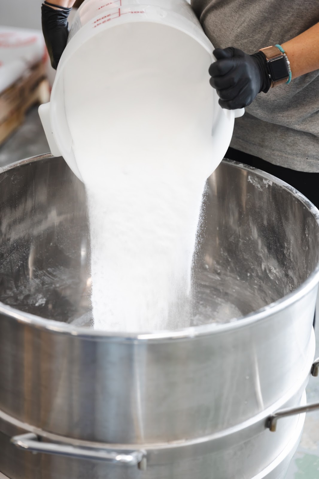 Old Whaling Co. employee Cam pouring citric acid and epsom salt