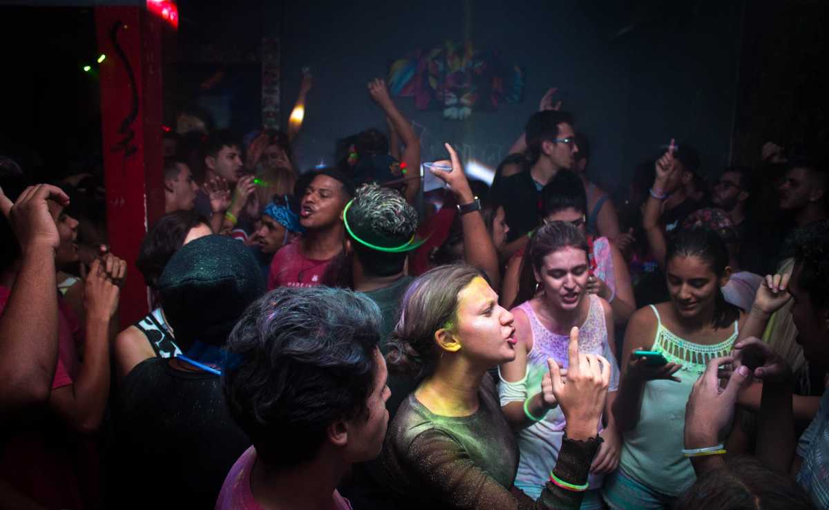 People dancing at a party in the La Placita de Santurce district in Puerto Rico