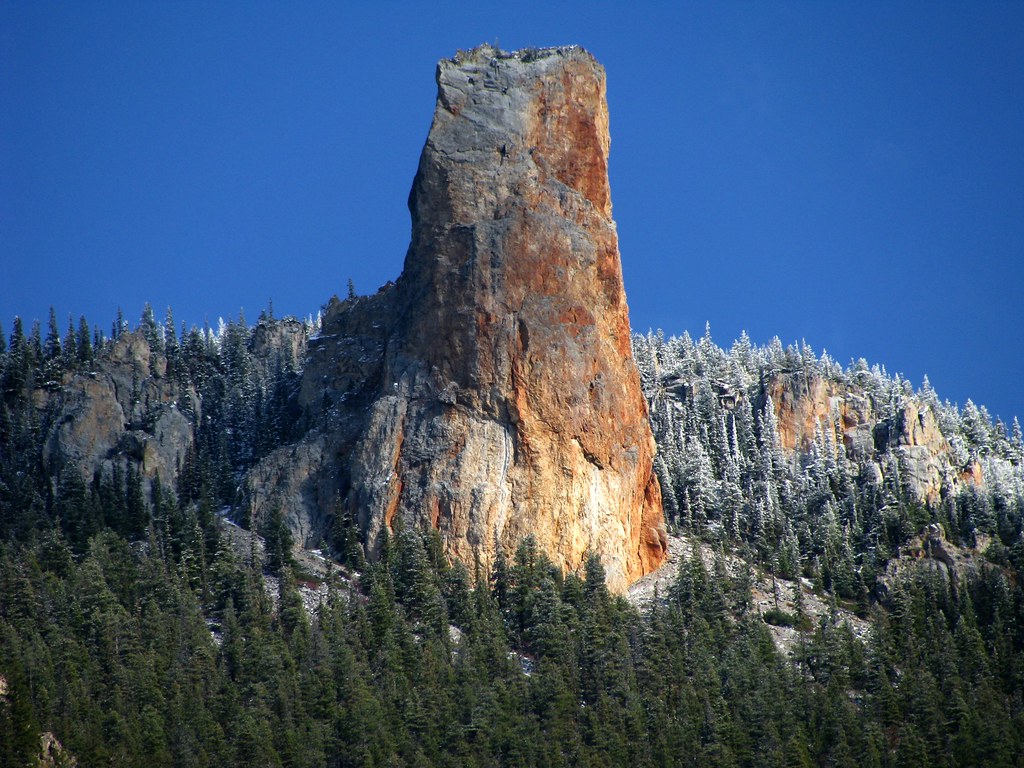 View from the top of Chimney Rock, showing the surrounding landscape and clear sky