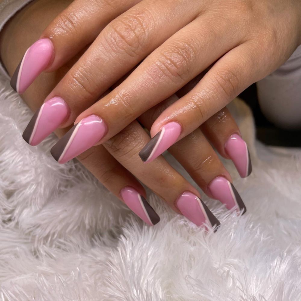 Close up of nails with simple pink nail designs having Pink and Brown Nails