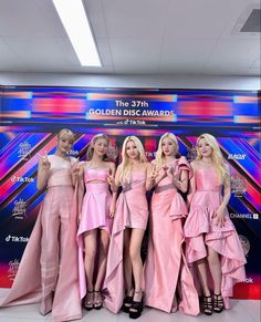 This  contain an image of GIDLE  girls in pink dresses are posing together