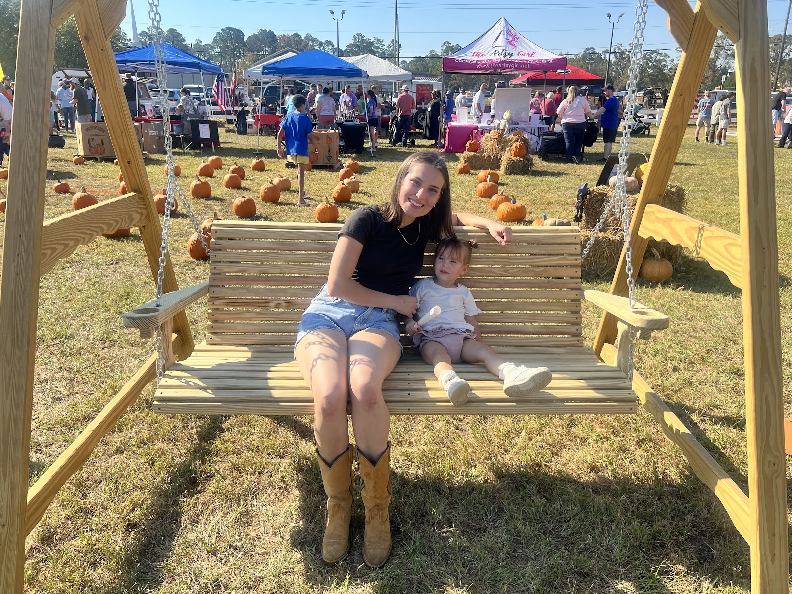 two people on a swinging bench