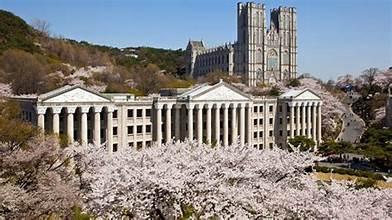 A building with many columns and a castle in the background

AI-generated content may be incorrect.