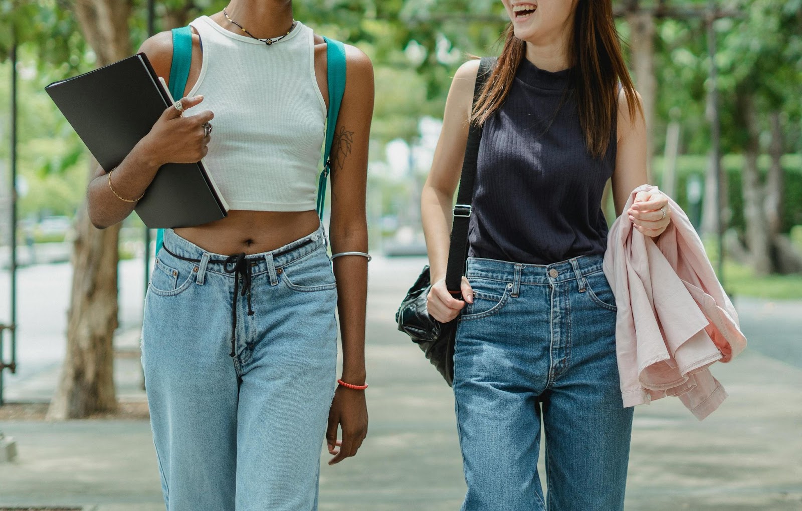 Two female college students walking