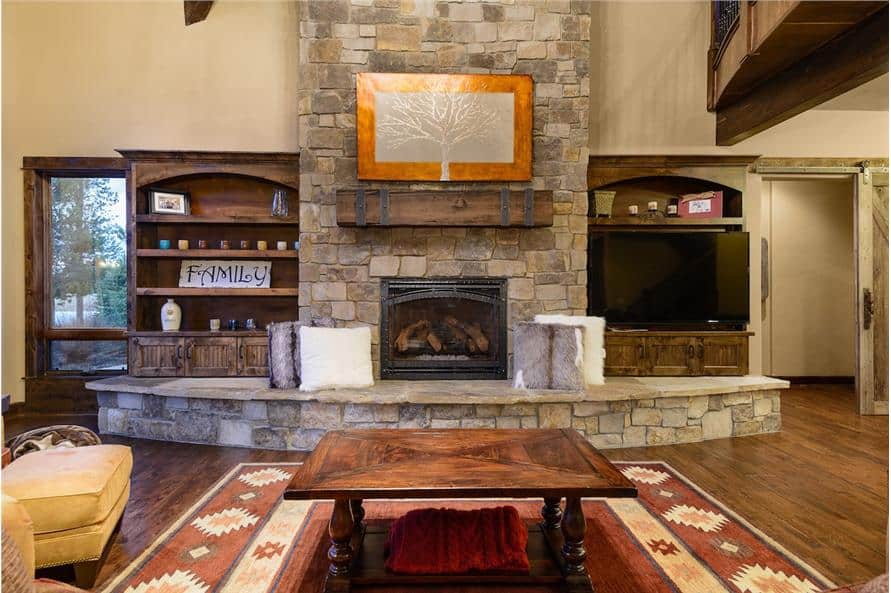 A stone fireplace and TV complete the great room.