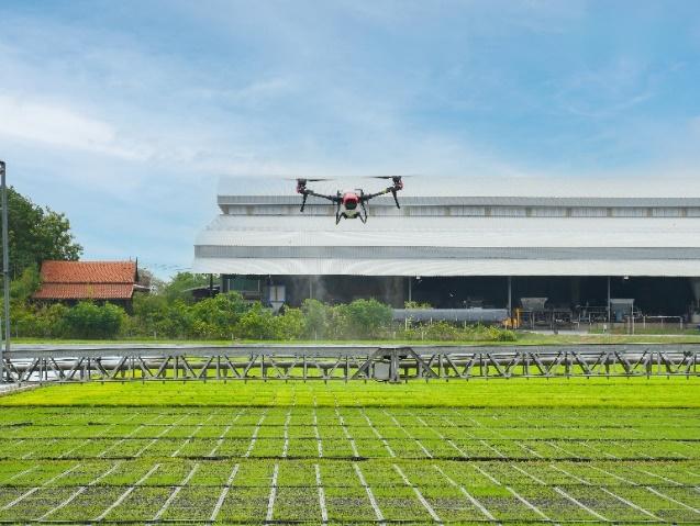 A drone flying over a farm

Description automatically generated