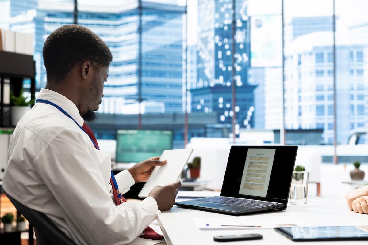 Talent management process: HR employee reading a notebook