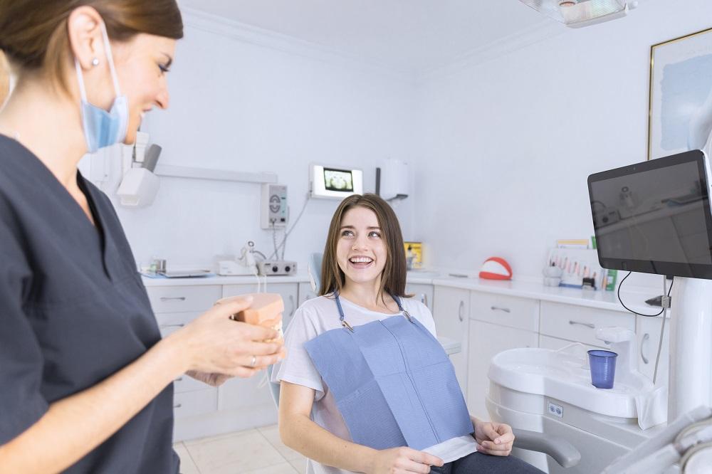 A happy satisfied patient at the dentist's office