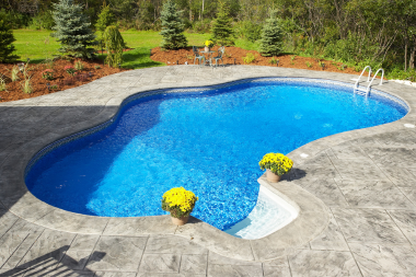 the complete guide to pool decks concrete deck with potted plants and landscaping custom built michigan