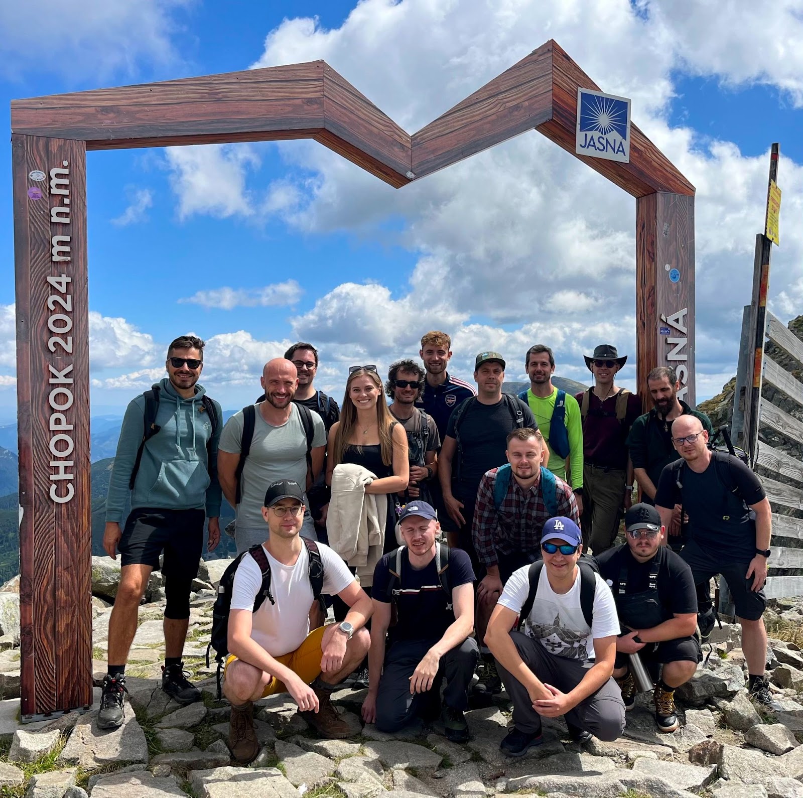 The team poses for a photo on top of the Chopok peak, in the Low Tatras, Slovakia.