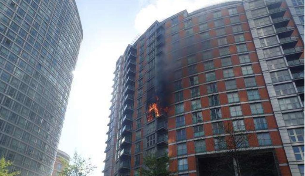 A building on fire with smoke coming out of the window

AI-generated content may be incorrect.