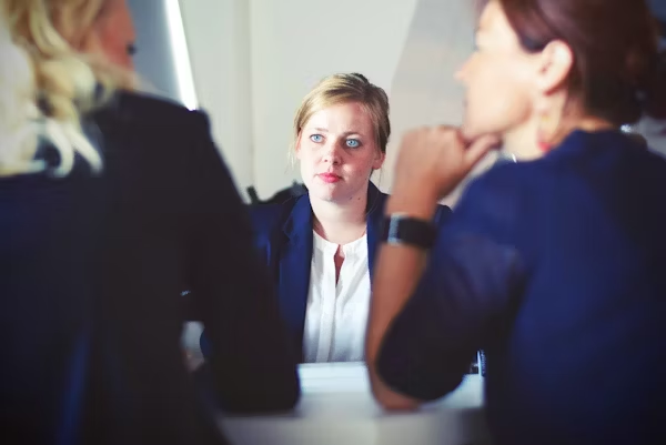 Interviewers interacting with a job applicant