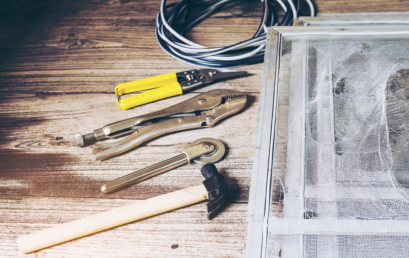 Photo of the tool set. The set includes a hammer, pliers, and multi-tools for repair