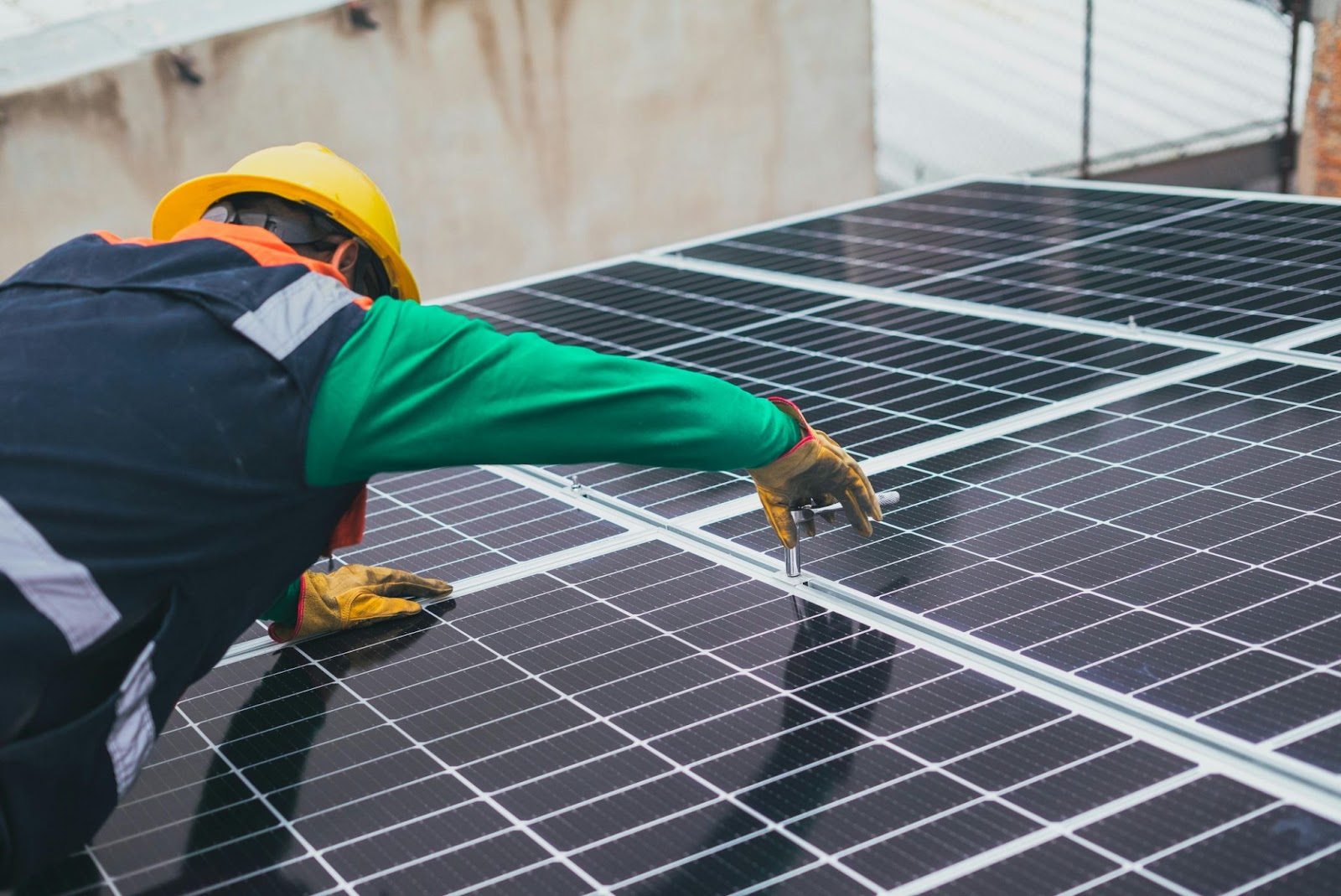 man installing solar panels