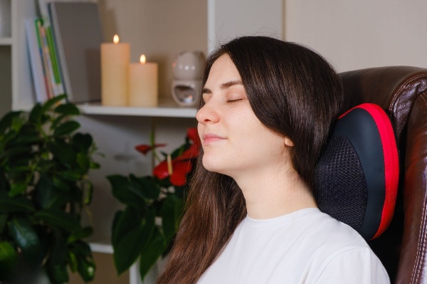 A woman resting comfortably on a cervical pillow,