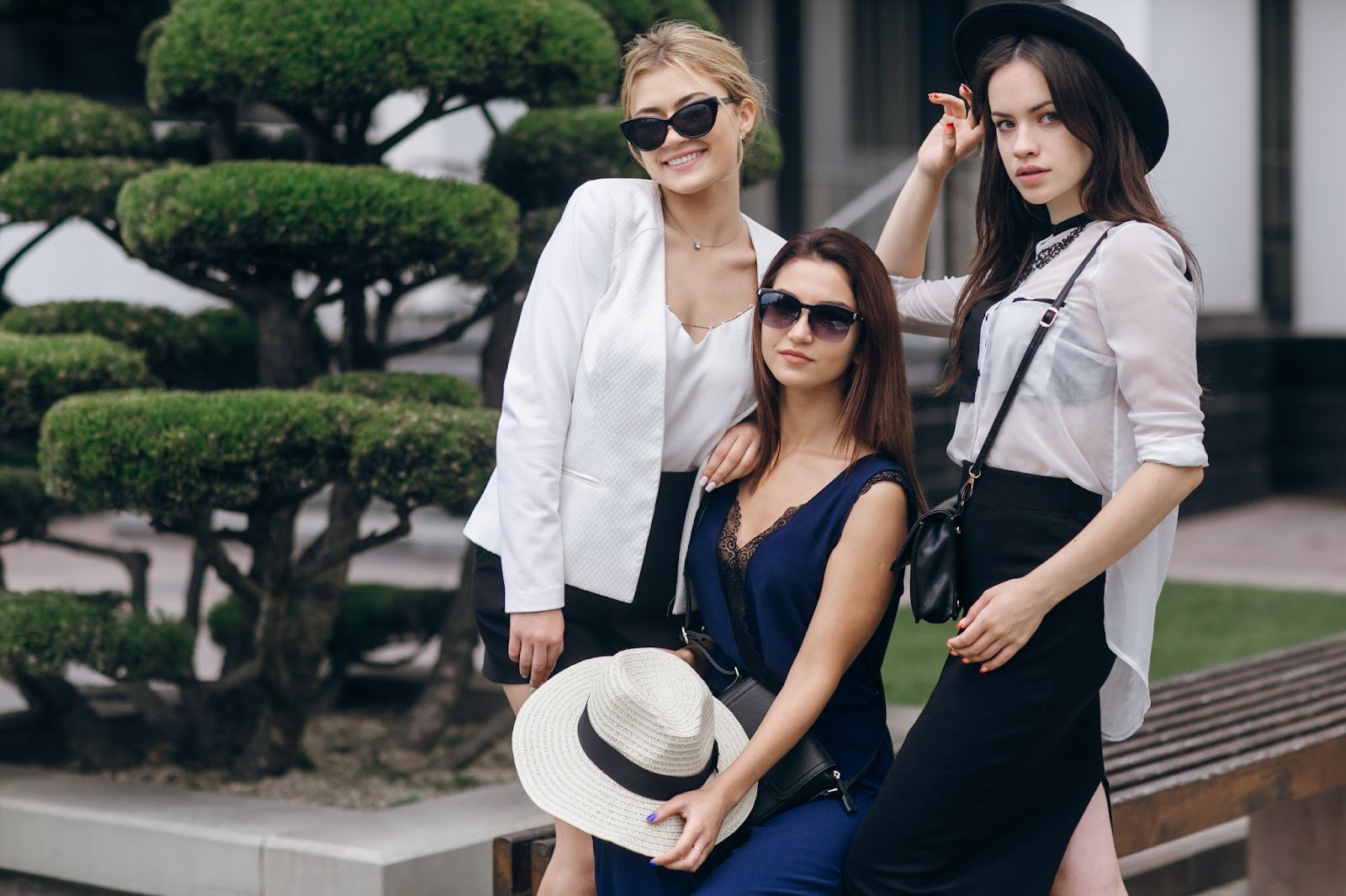 three young ladies posing at the camera