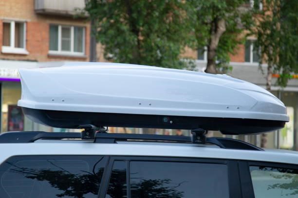 The trunk on the car roof to transport goods. The trunk on the car roof to transport goods. XT Roof Box stock pictures, royalty-free photos & images