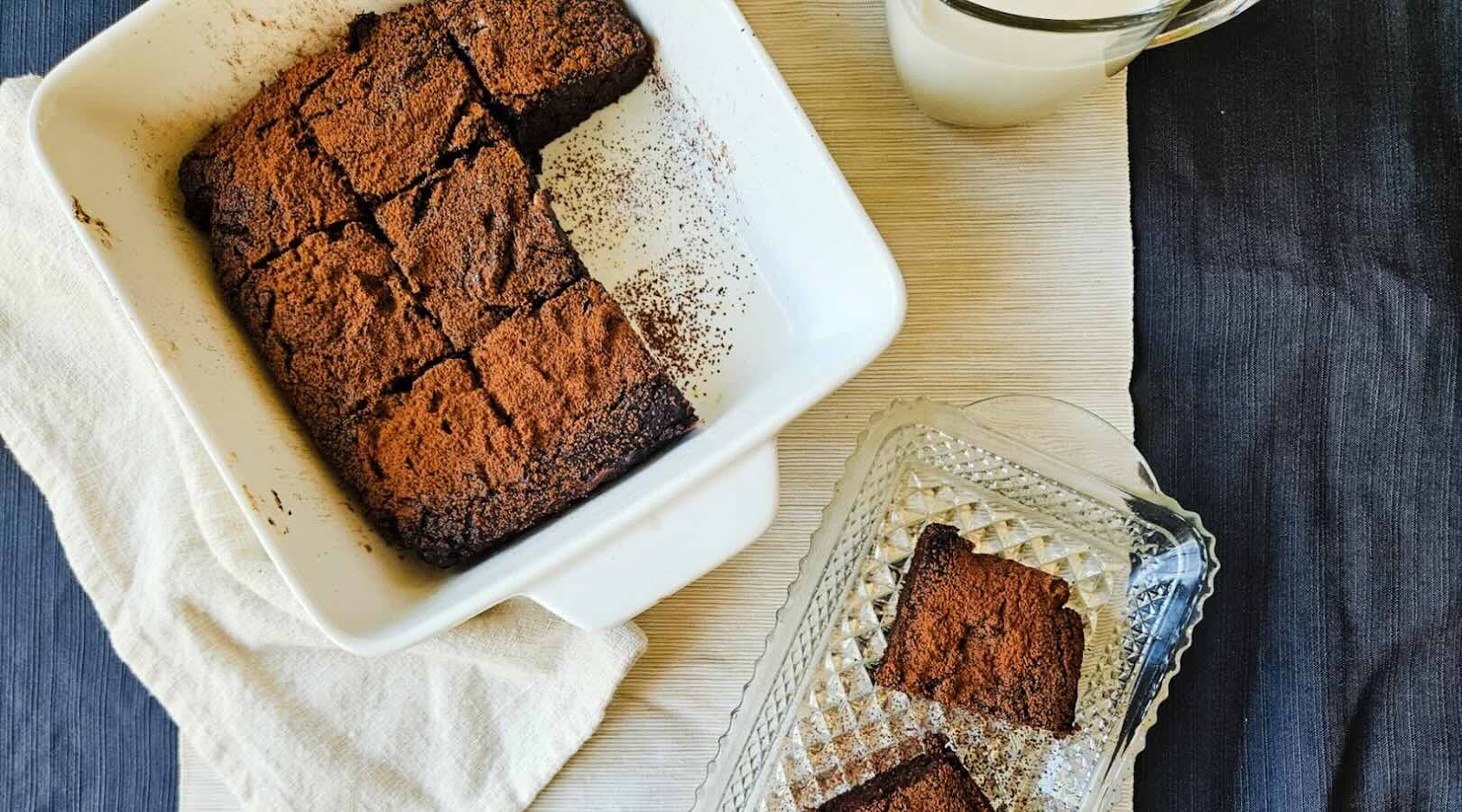 Pumpkin Brownies Created by a Registered Dietitian in a White Dish on White and Blue Fabric