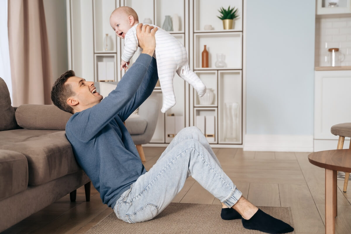 FMLA Utah: father playing with his baby